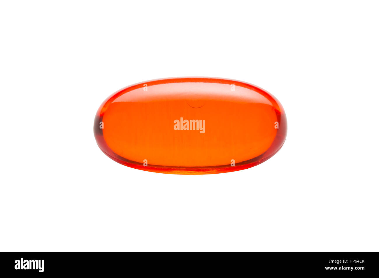 Orange gelatin capsule or pill isolated on a white background.  Medically themed studio macro with backlighting for extra pop. Stock Photo