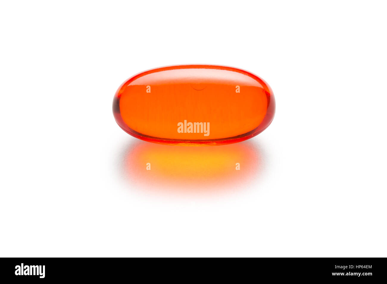 Orange gelatin capsule or pill isolated on a white background