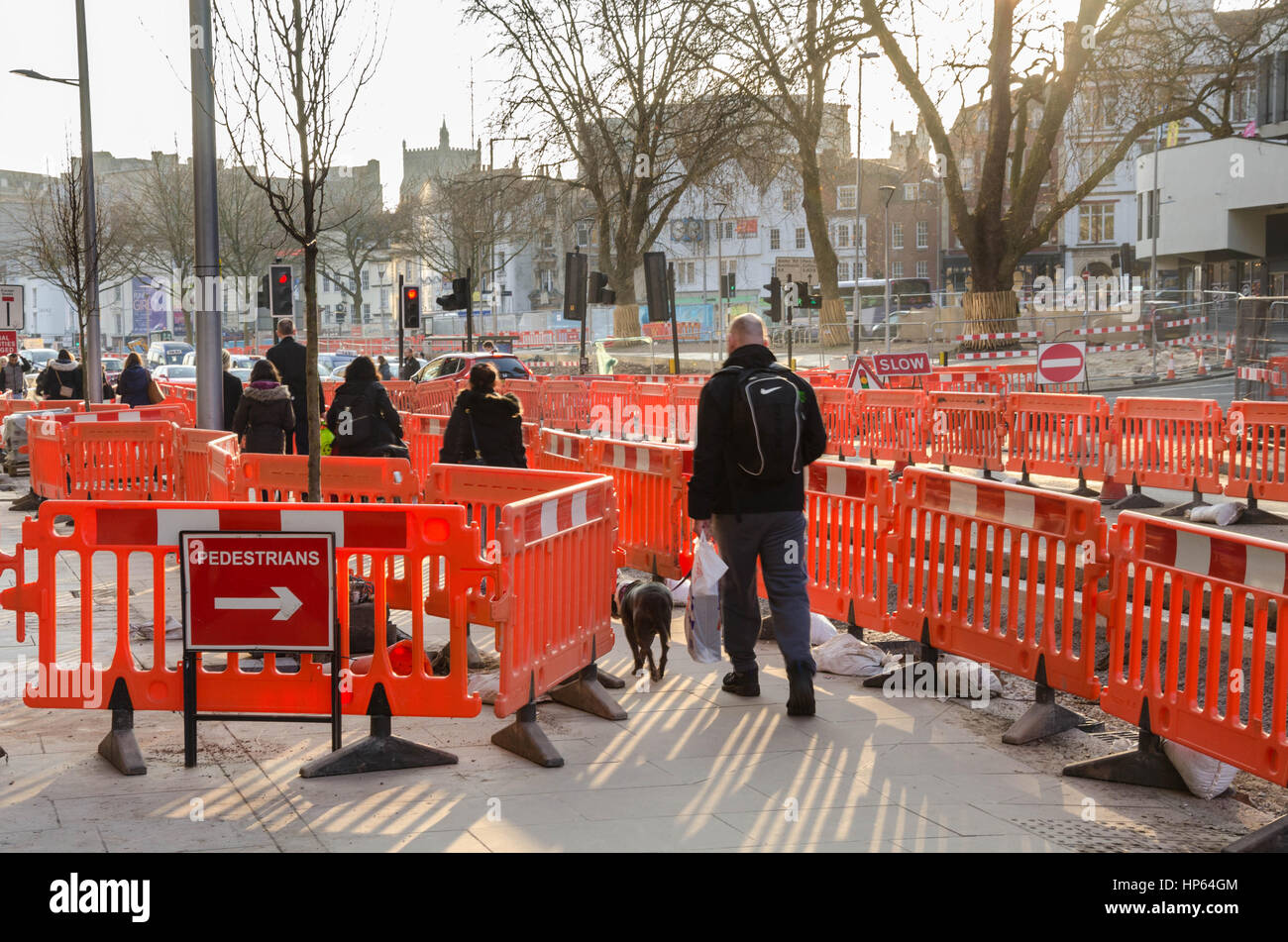 Barriers directing pedestrians while works are carried out to the road and pavement. Stock Photo