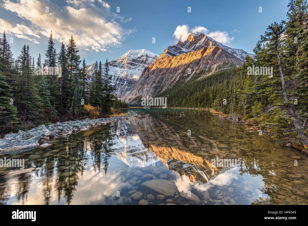 Sunrise and reflection of Mount Edith Cavell in the Rocky Mountains of Jasper National Park, Alberta, Canada Stock Photo
