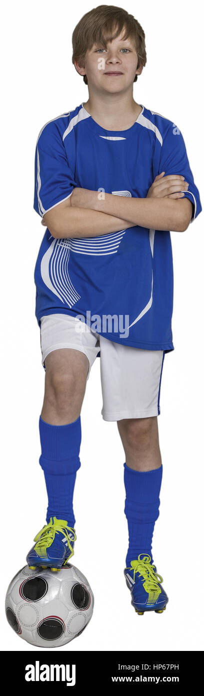 Junge steht mit einem Bein auf Fussball, verschraenkte Arme (model-released) Stock Photo