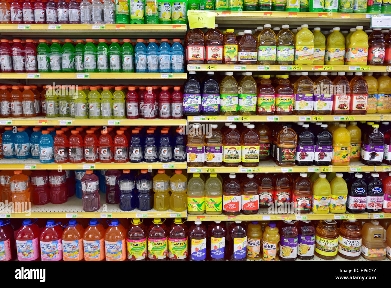 Bottles of variety of fruit juices on supermarket shelves, USA Stock Photo