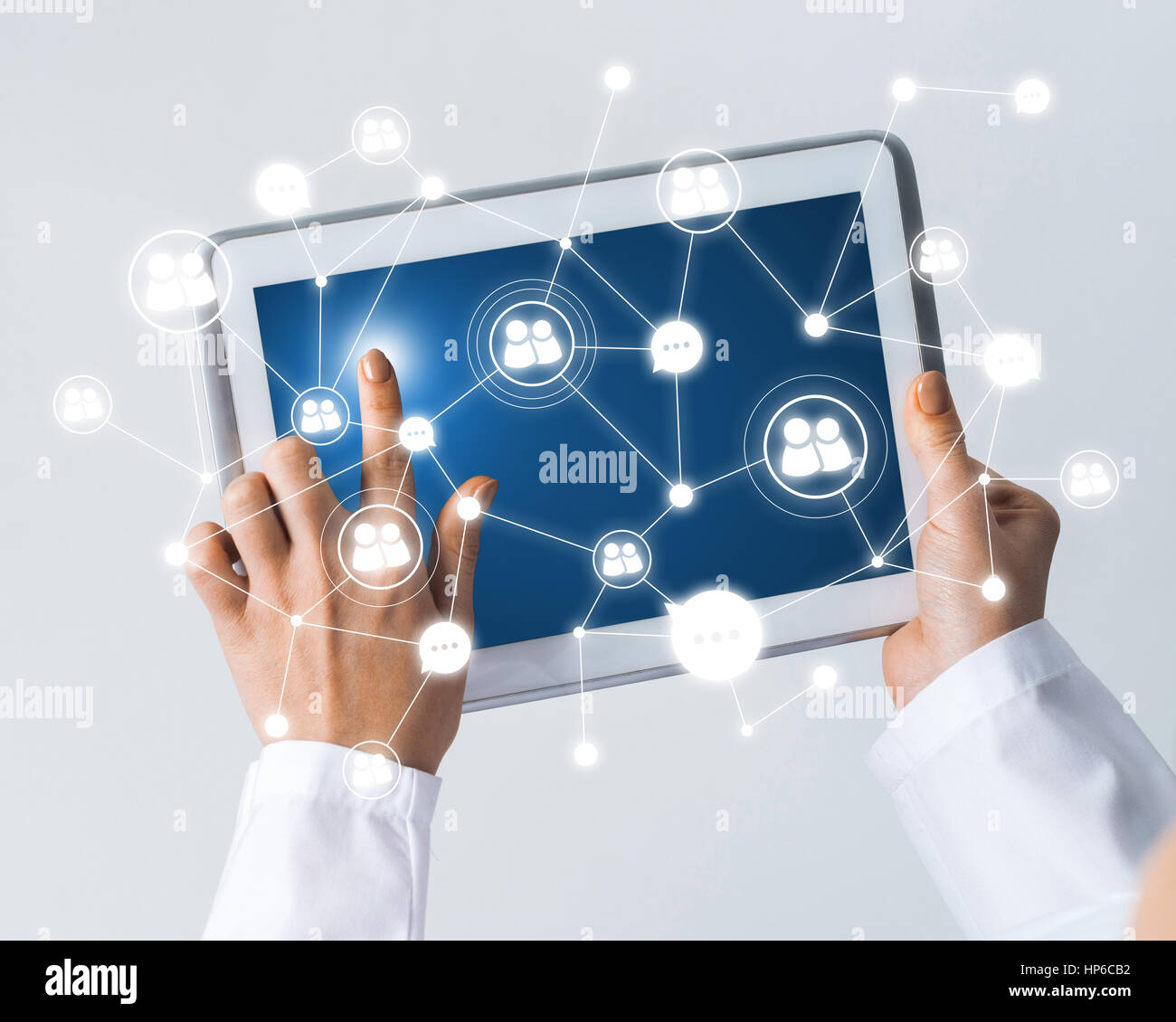 Tablet pc device with connection lines on screen in hands of doctor ...