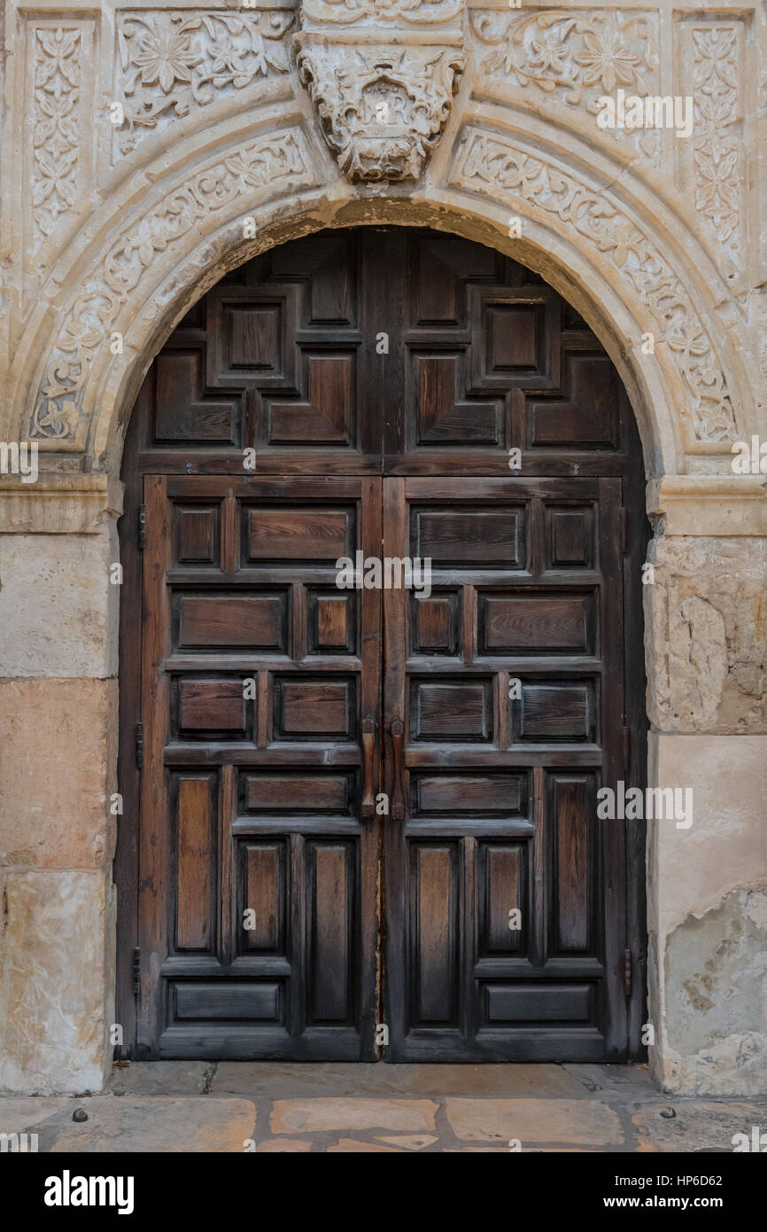 Old Spanish Mission Doors made of thick carved wood Stock Photo
