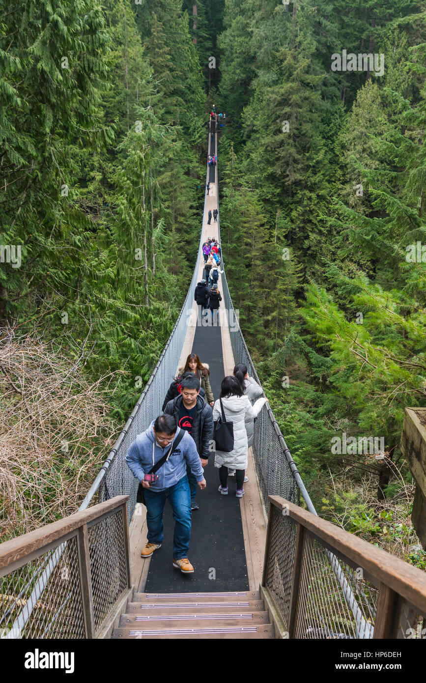 Vancouver, Canada - January 28, 2017: Tourists enjoying a day at the Capilano Suspension Bridge. Stock Photo