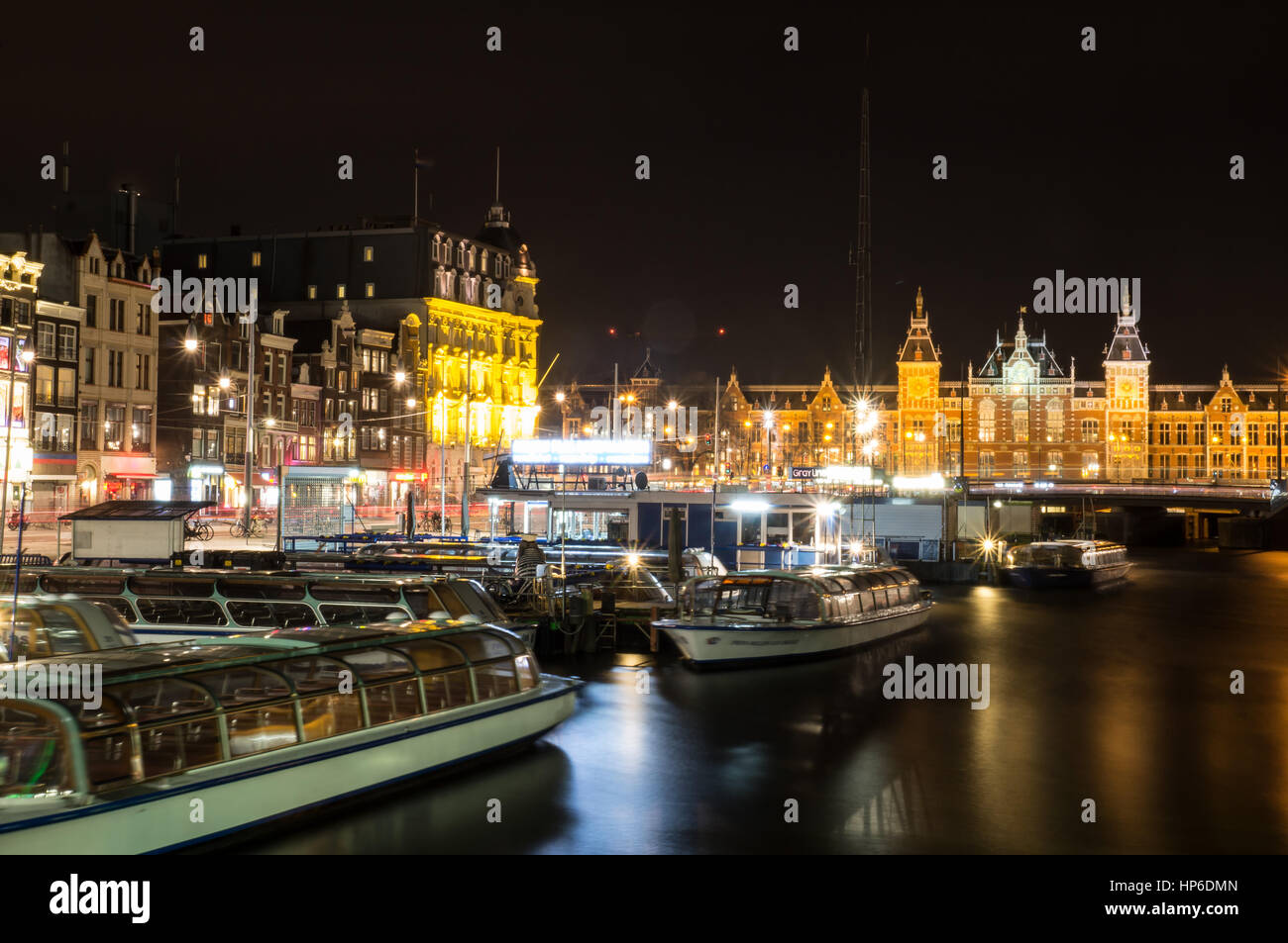 City scenic from Amsterdam by night with the central station Stock Photo
