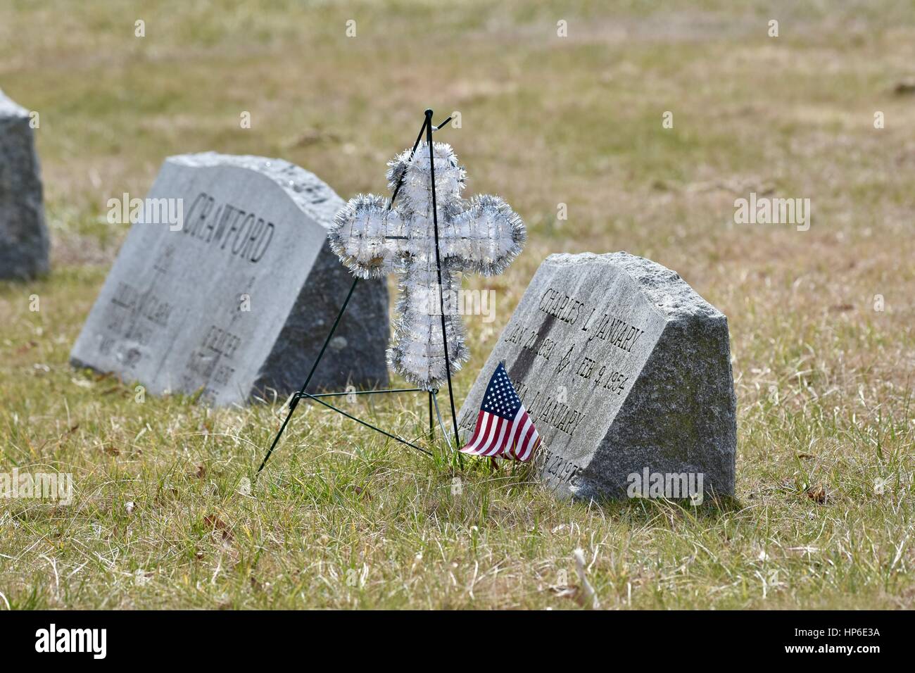 Tombstone at a small cemetery with remembrance left behind Stock Photo