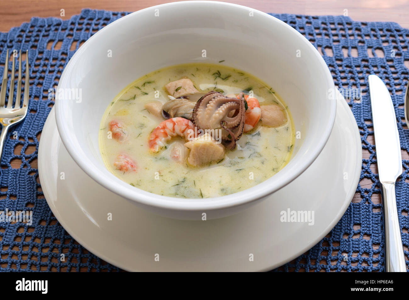 Creamy soup with seafood Stock Photo Alamy