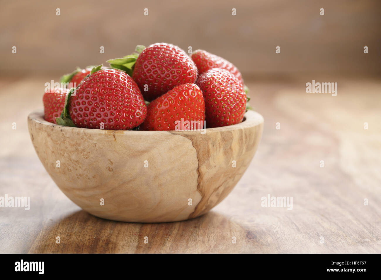 fresh strawberries in bowl on wood table, organic garden berries Stock ...