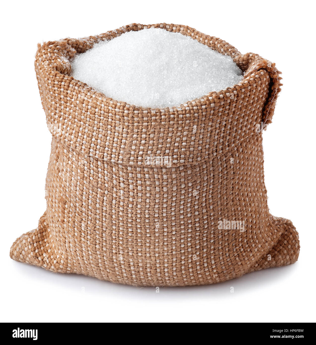 sugar in burlap sack isolated on white background. Full bag of sugar crystals closeup Stock Photo