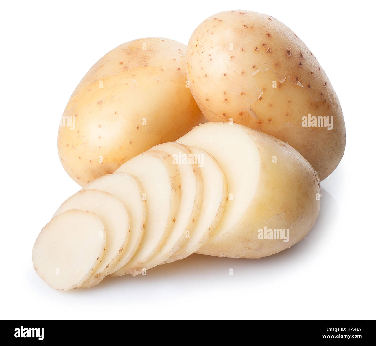 Sliced potatoes. Fresh potatoes isolated on white background. New whole potato and slices isolated on white background closeup Stock Photo