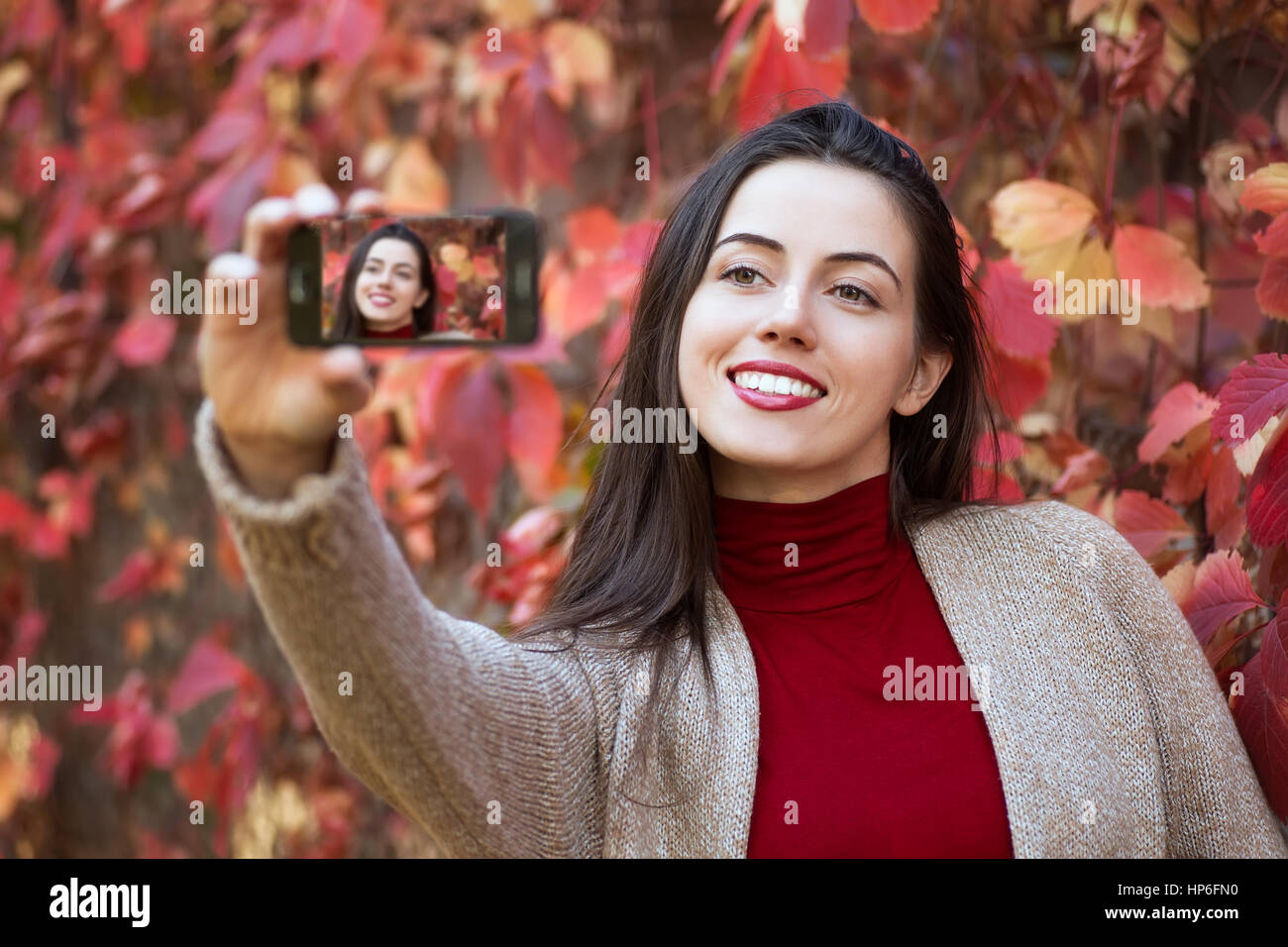 Beautiful Young Brunette Caucasian Woman Taking Selfie With Smartphone