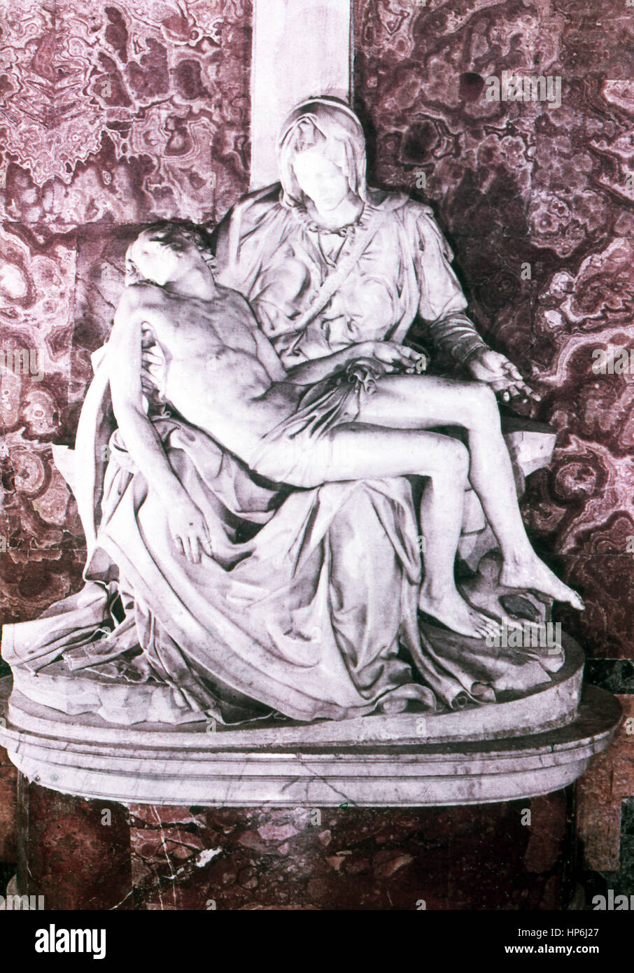 This sculpture by the Italian sculptor painter Michelangelo (1475-1564) is titled Pieta. The Italian sculptor, painter, and architect Michelangelo carved Christ lying in the arms of his mother Mary just after the crucifixion. One of his two best known works (the other is David), it was completed in 1499. It is now housed in the Vatican Museum. The photo dates to 1964. Stock Photo