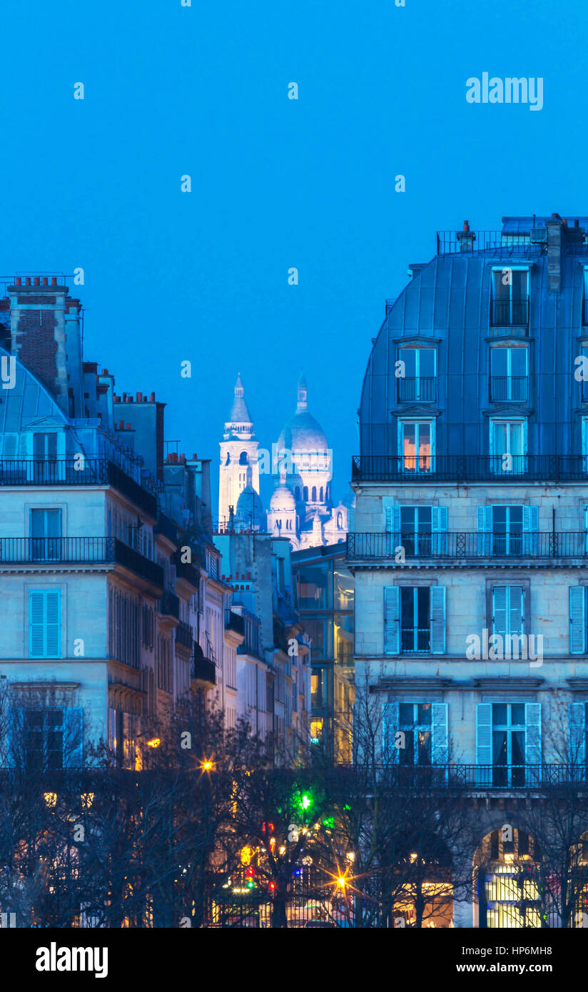 The "Sacre-Coeur" basilica seen between two Haussman-style buildings, Paris, France. Stock Photo