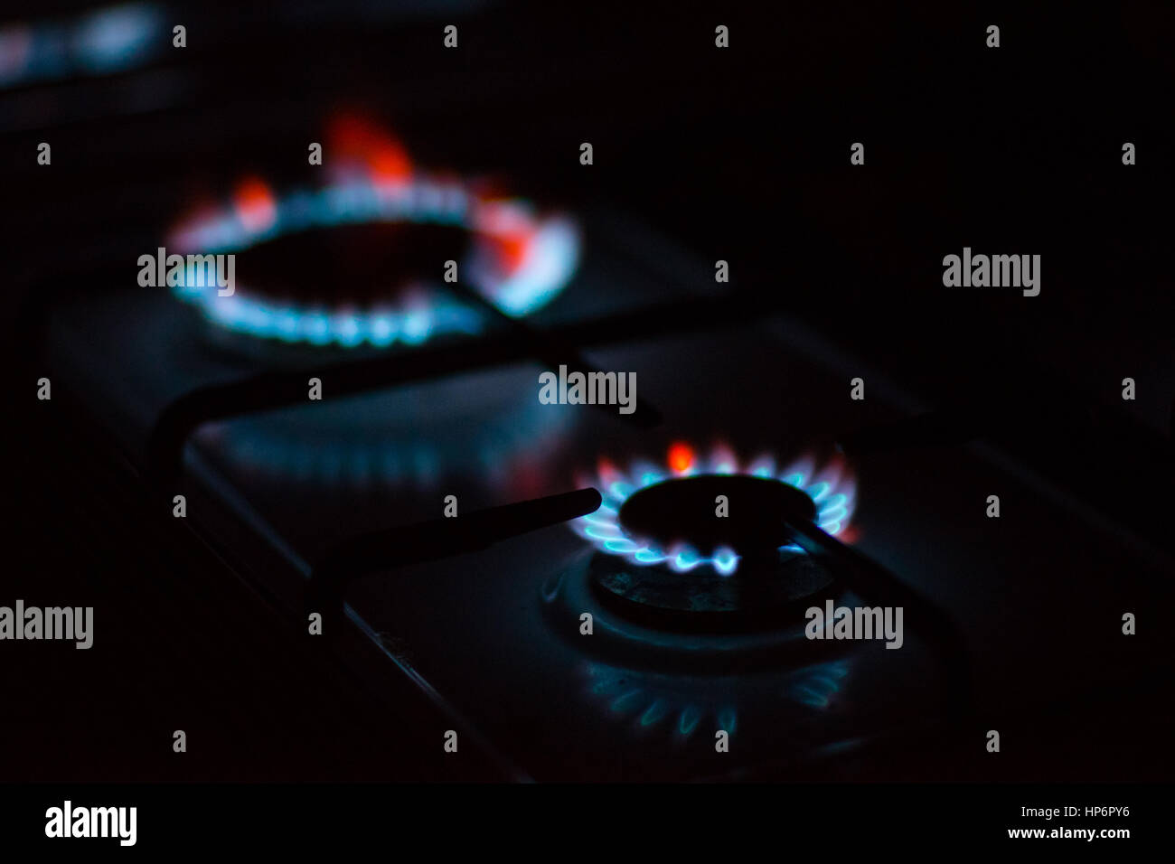 Flames of gas burners on stove Stock Photo