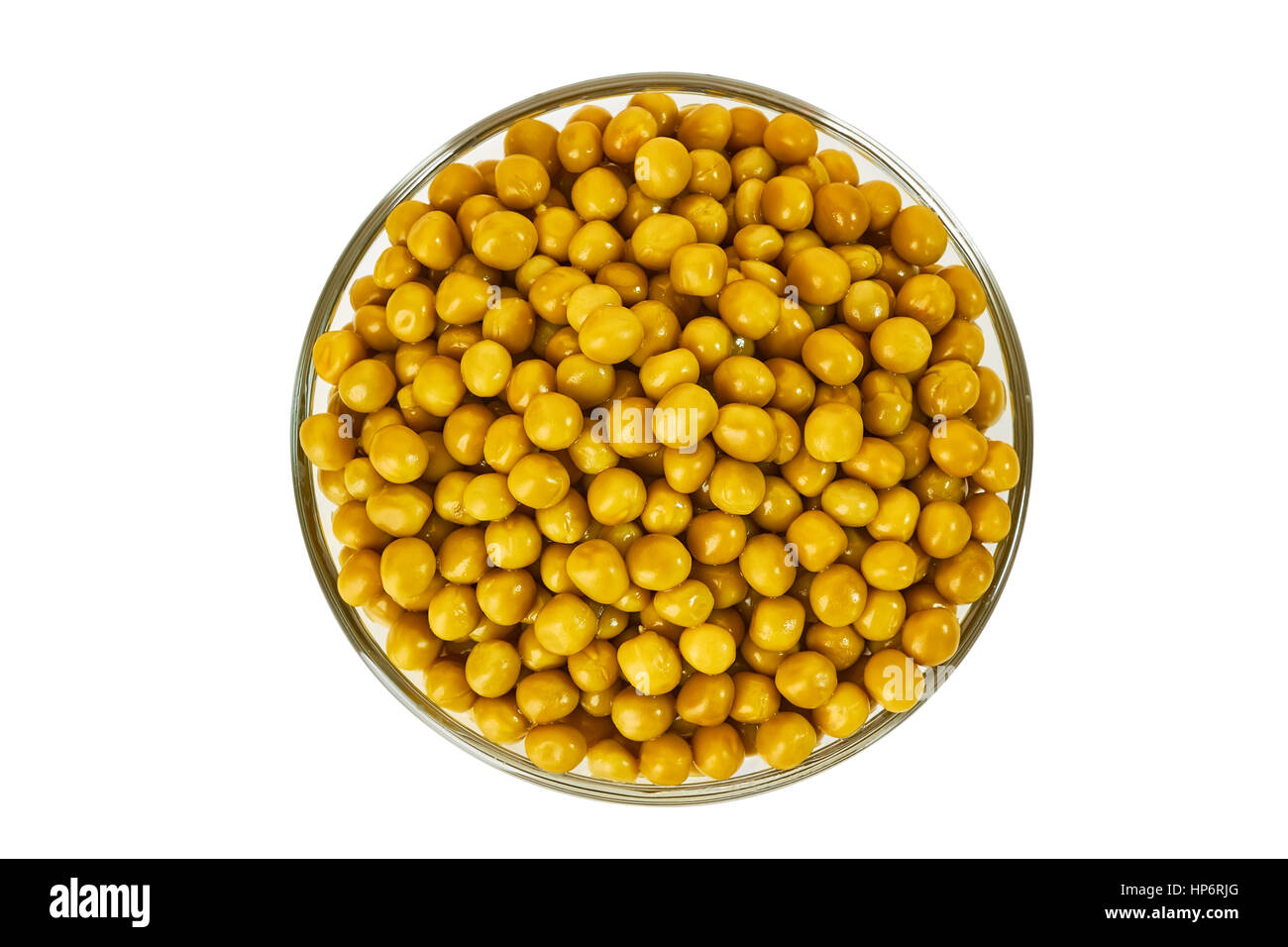 Glass bowl of pickled green pea on white Stock Photo
