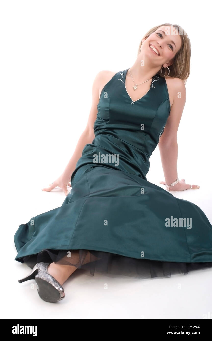 Junge, attraktive Frau, 30, im gruenen Abendkleid - younf, attractive woman in evening dress Stock Photo