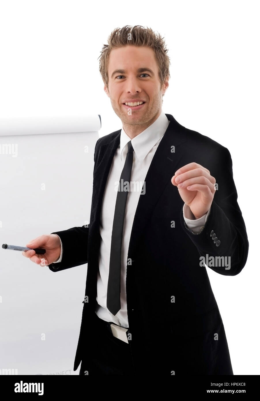 Junger Referent steht vor Flipchart business man front of flip chart
