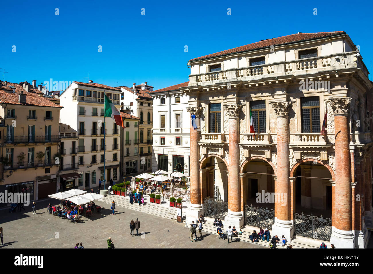 Vicenza,Italy-April 3,2015:people stroll in front of the Capitaniato  lodge in the Vicenza town square .during a sunny day. Stock Photo