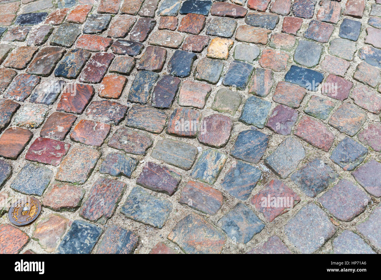 Old dark colorful cobblestone road background photo Stock Photo - Alamy