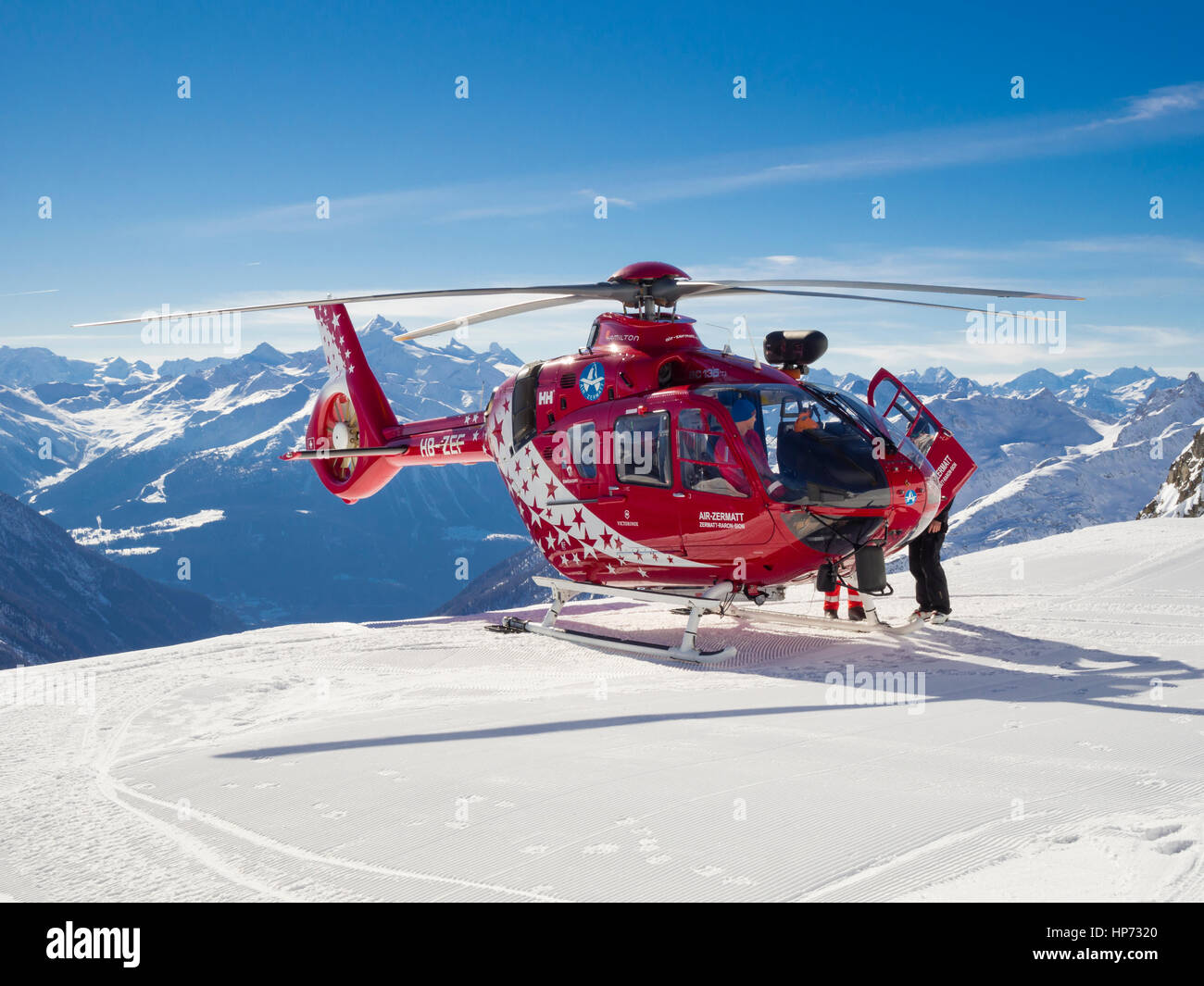 Lauchernalp, Switzerland - 13 February 2017: A Eurocopter EC135 helicopter  of Swiss "Air Zermatt" helicopter airline is landed on the snow covered ski  Stock Photo - Alamy