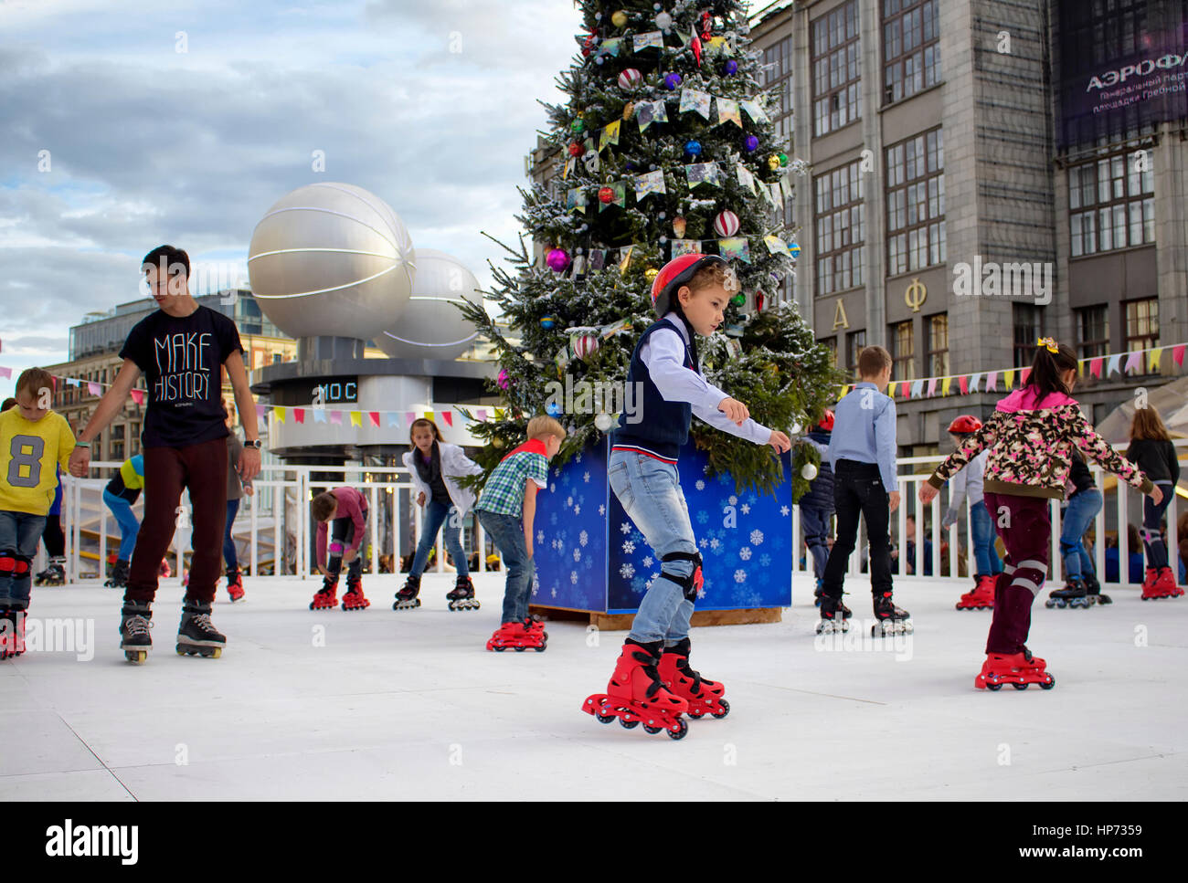 Children skate at Moscow City Day Celebrations and Festival on Tverskaya street. Christmas tree is in the middle. Over a thousand events citywide are  Stock Photo