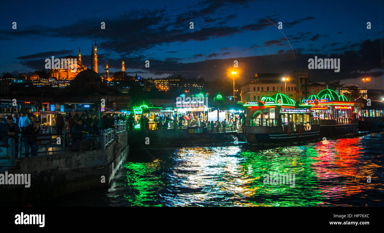 Istanbul, Turkey – March  20, 2015: Cooked fish and bread sold in boat Stock Photo