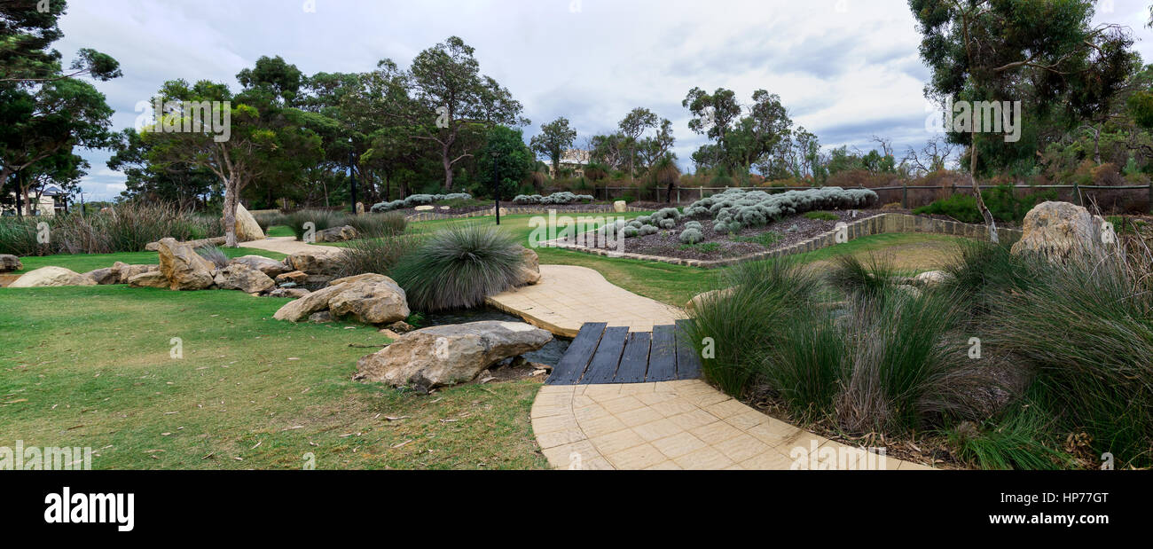 Panorama Joondalup Central Park with walkpath, garden and stream Stock