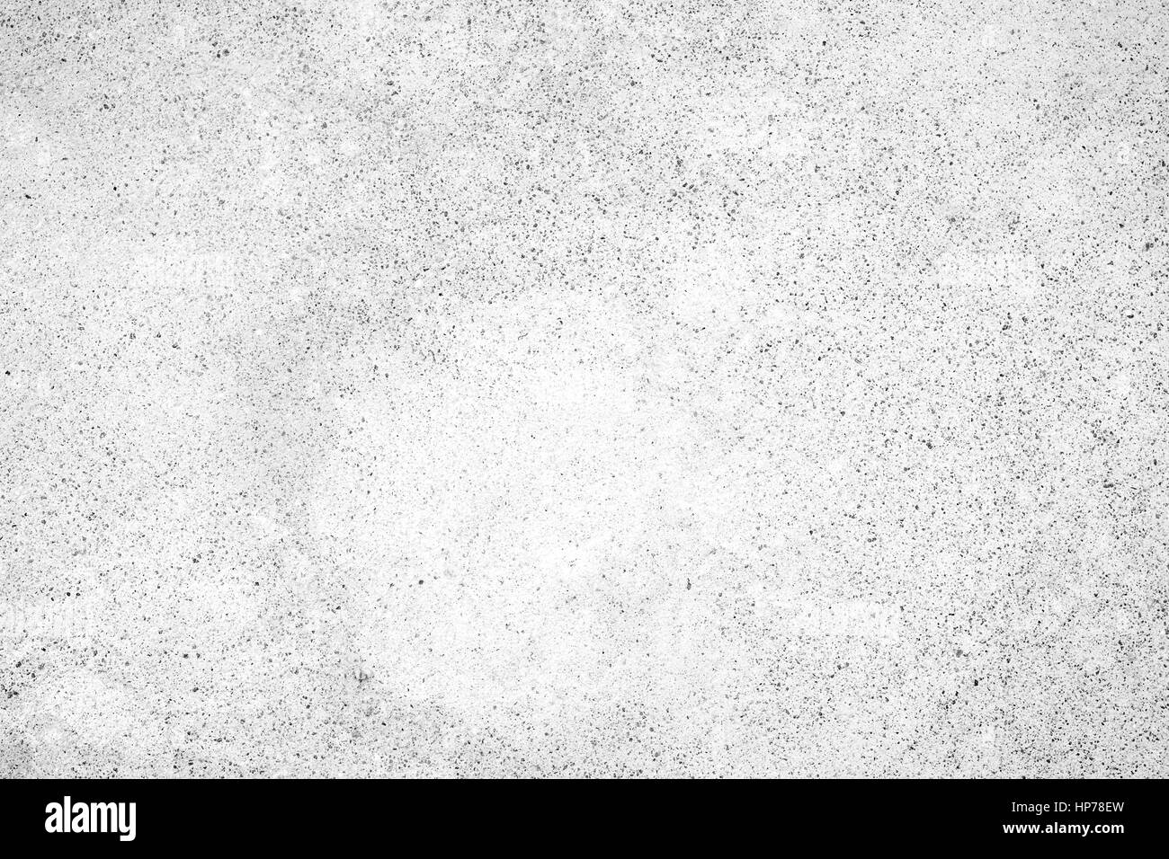 Light gray concrete wall texture background, paint partly faded, in black&white. Stock Photo