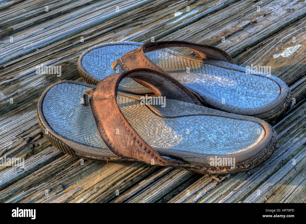 Frost covered flips flops left on the dock Stock Photo - Alamy