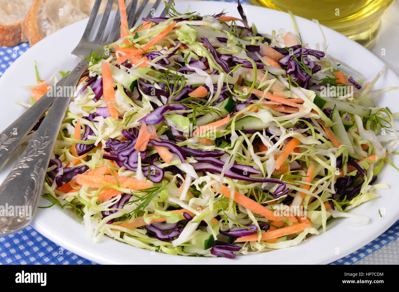 Salad coleslaw red and white cabbage with carrots and cucumber Stock