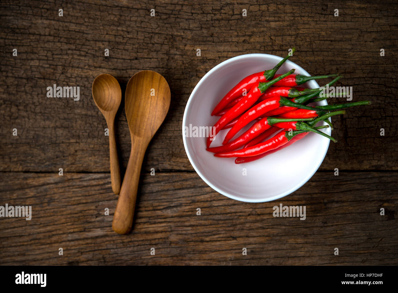 red hot chili peppers on a wooden board Stock Photo - Alamy