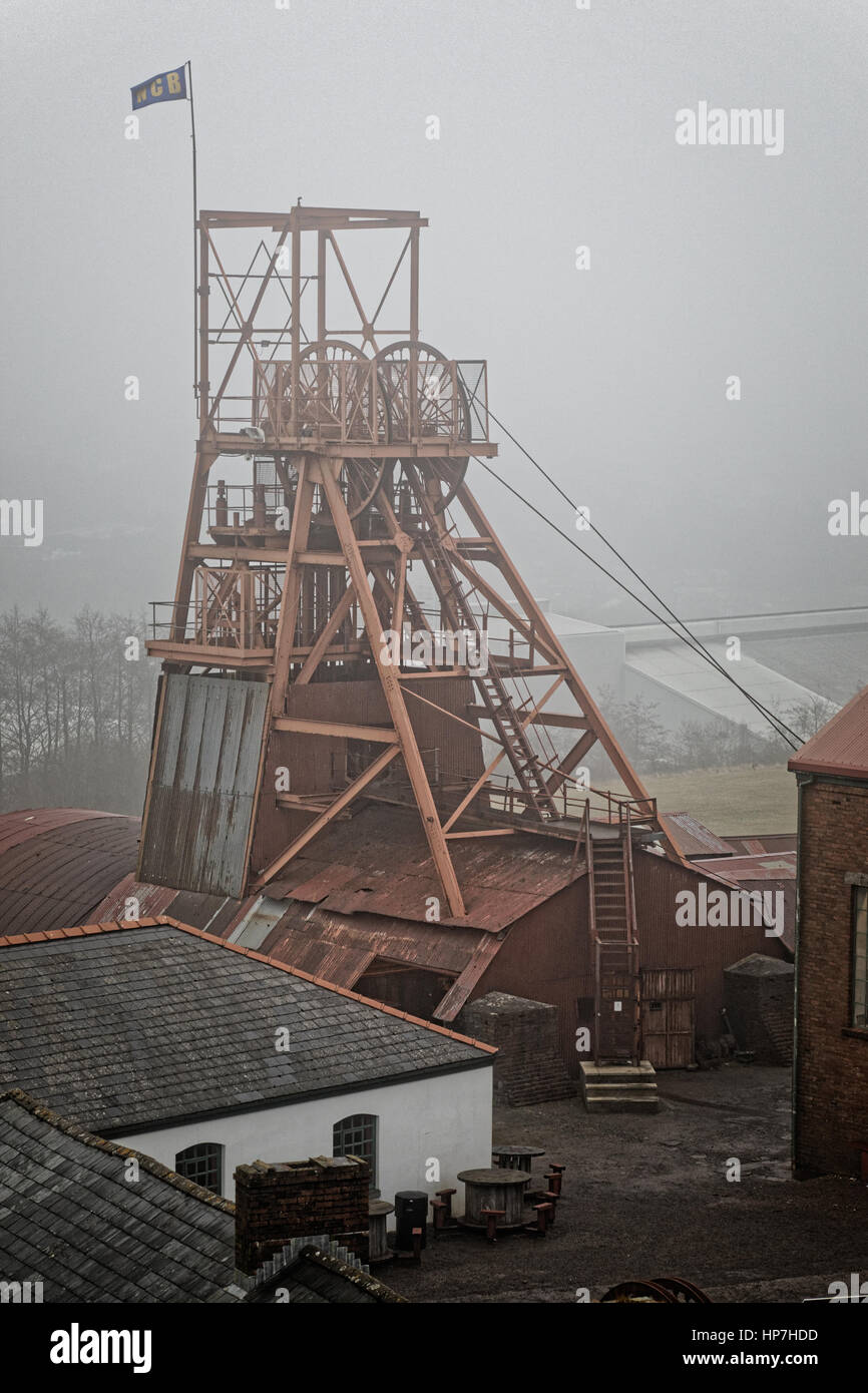 Big Pit Welsh coal mine winding tower under grey sky Stock Photo