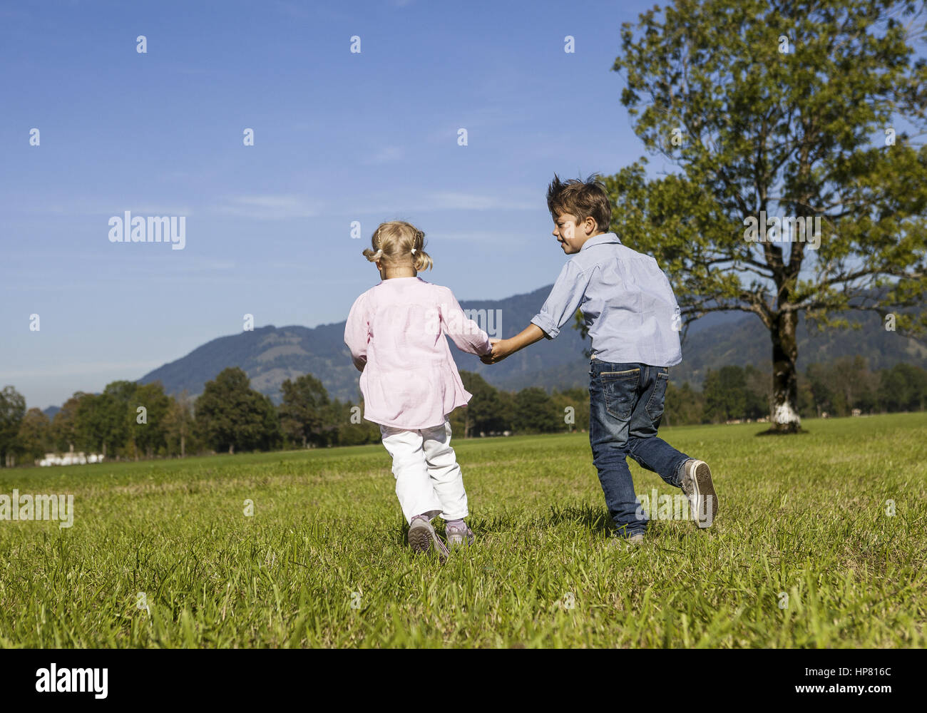 two-children-youngsters-back-high-resolution-stock-photography-and