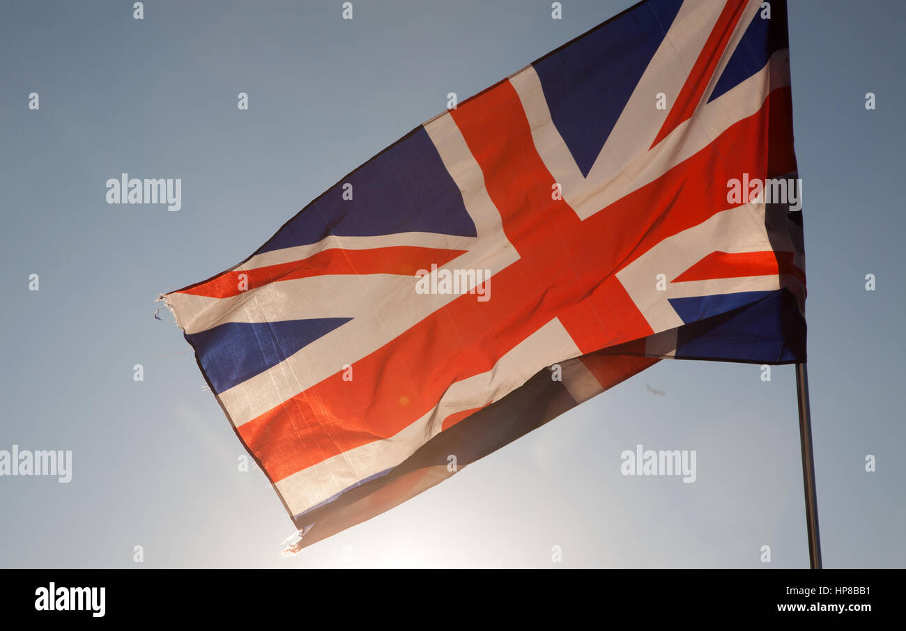 close up of Union Jack flag against blue sky Stock Photo - Alamy