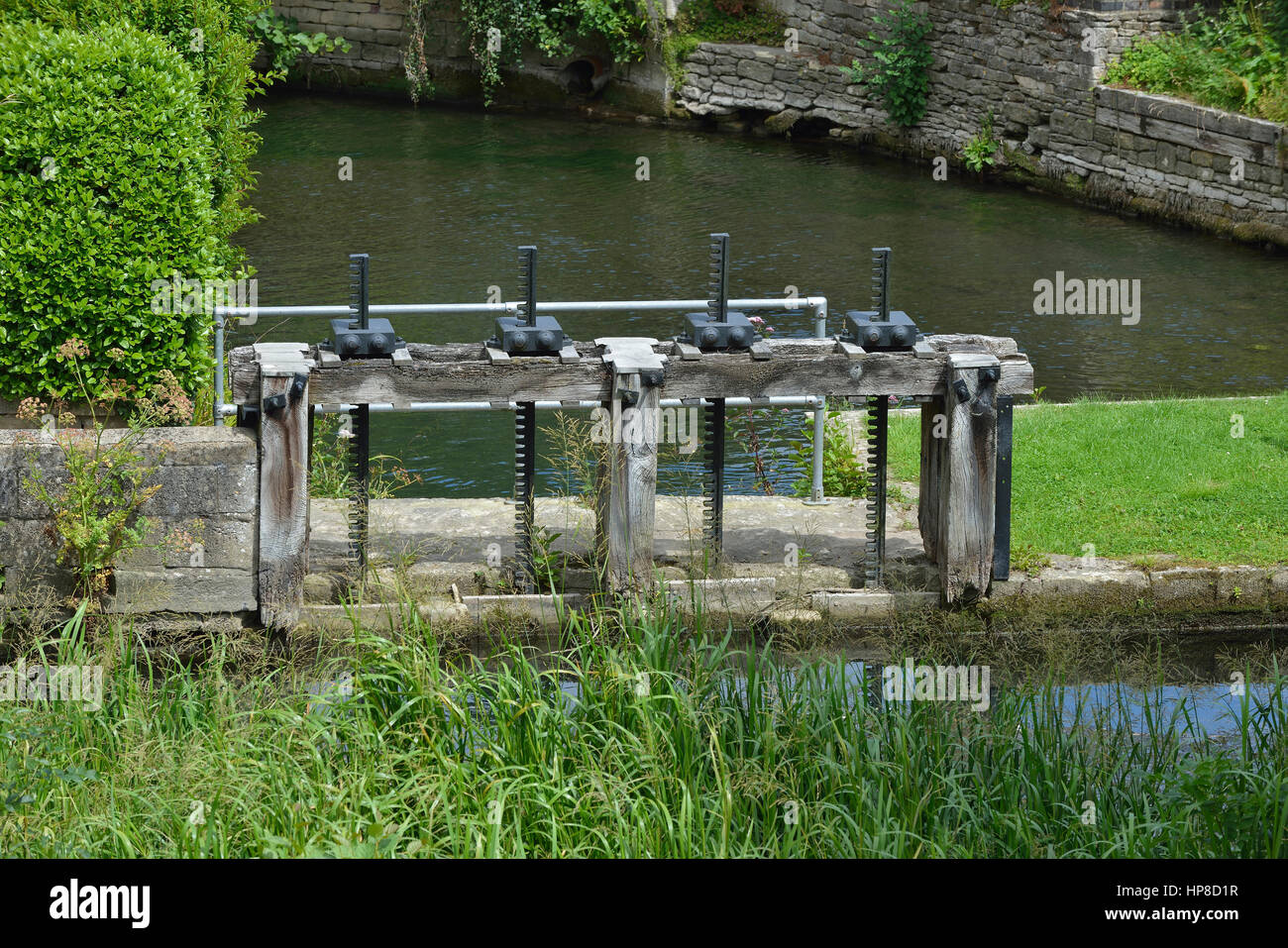 Mill Pond with Sluice Gate Winding Gears, Brimscombe Mill, Stroud, Gloucestershire Stock Photo