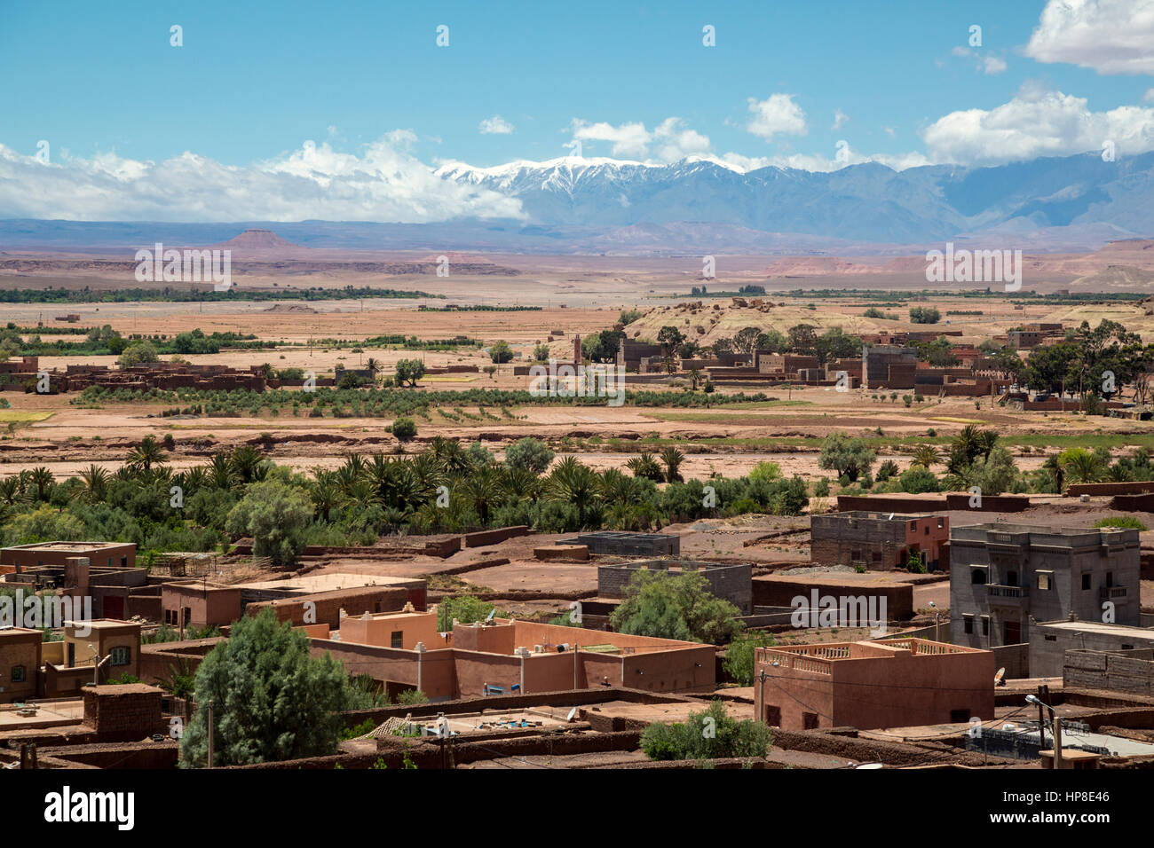 Atlas Mountains, Morocco.  Snow on Mountains in May, Village in Foreground. Stock Photo