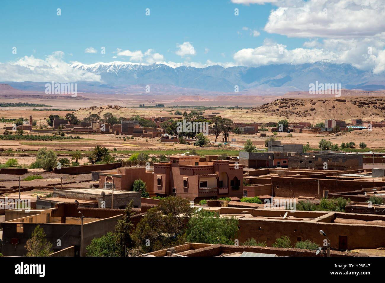 Atlas Mountains, Morocco.  Snow on Mountains in May, Village in Foreground. Stock Photo