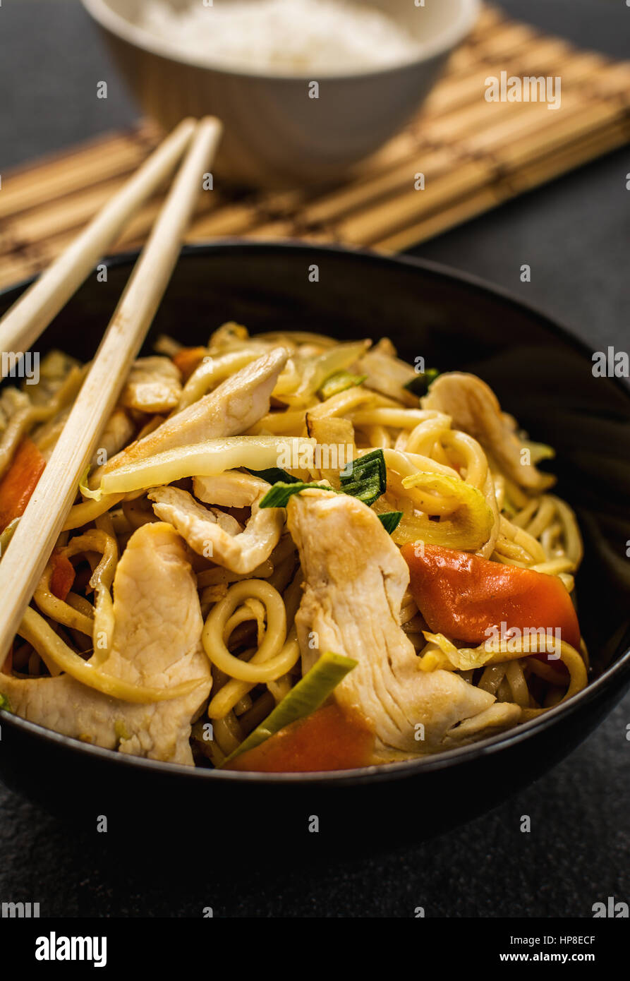 Asian or chinese noodles with chicken noodles and vegetables Stock