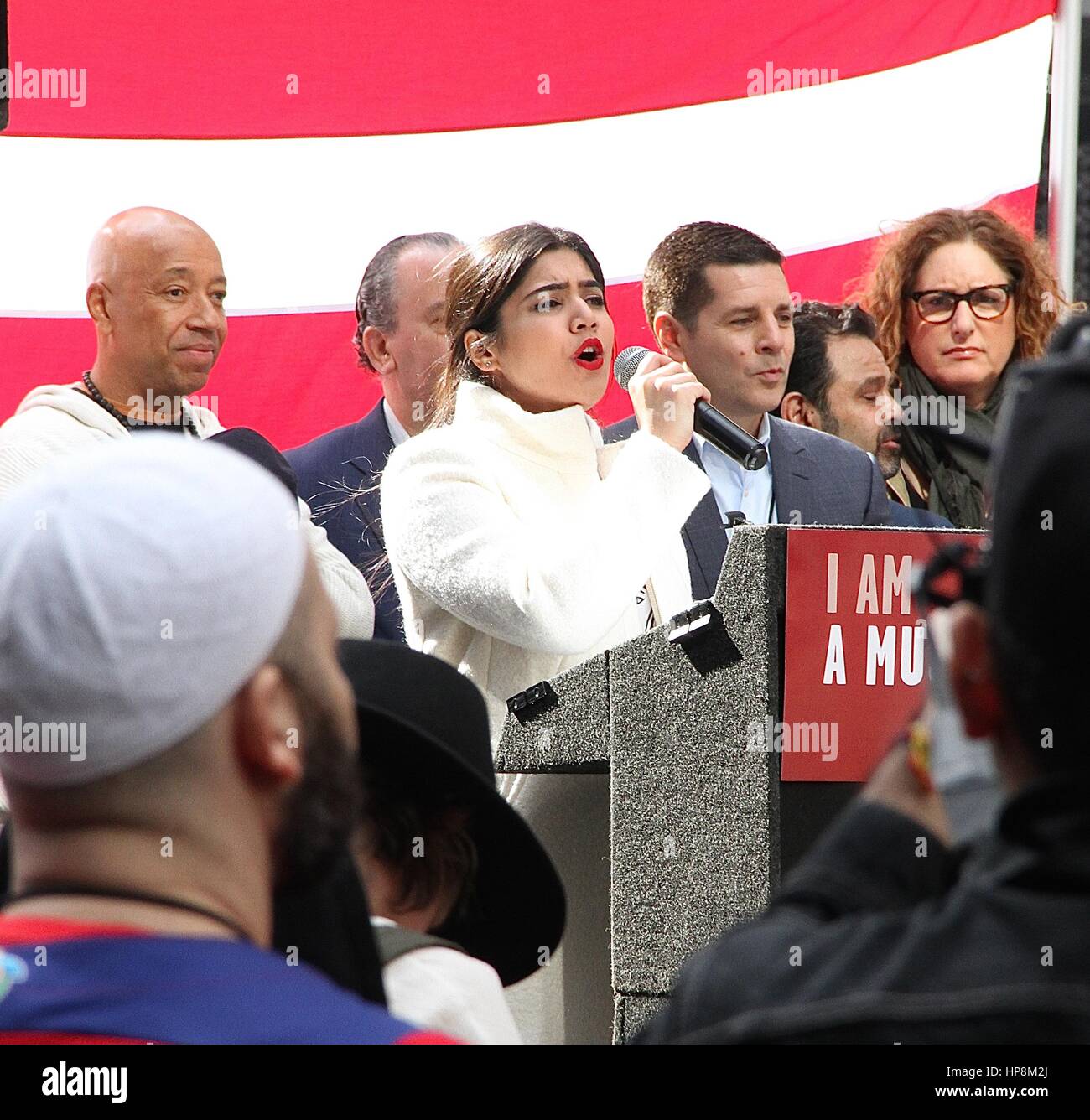 New York, NY, USA. 19th Feb, 2017. A woman singing the National Anthem at the 'I Am Muslim Too' rally in Times Square coordinated by hip hop mogul Russell Simmons and a group of interfaith religious leaders in New York, New York on February 19, 2017. Credit: Rainmaker Photo/Media Punch/Alamy Live News Stock Photo