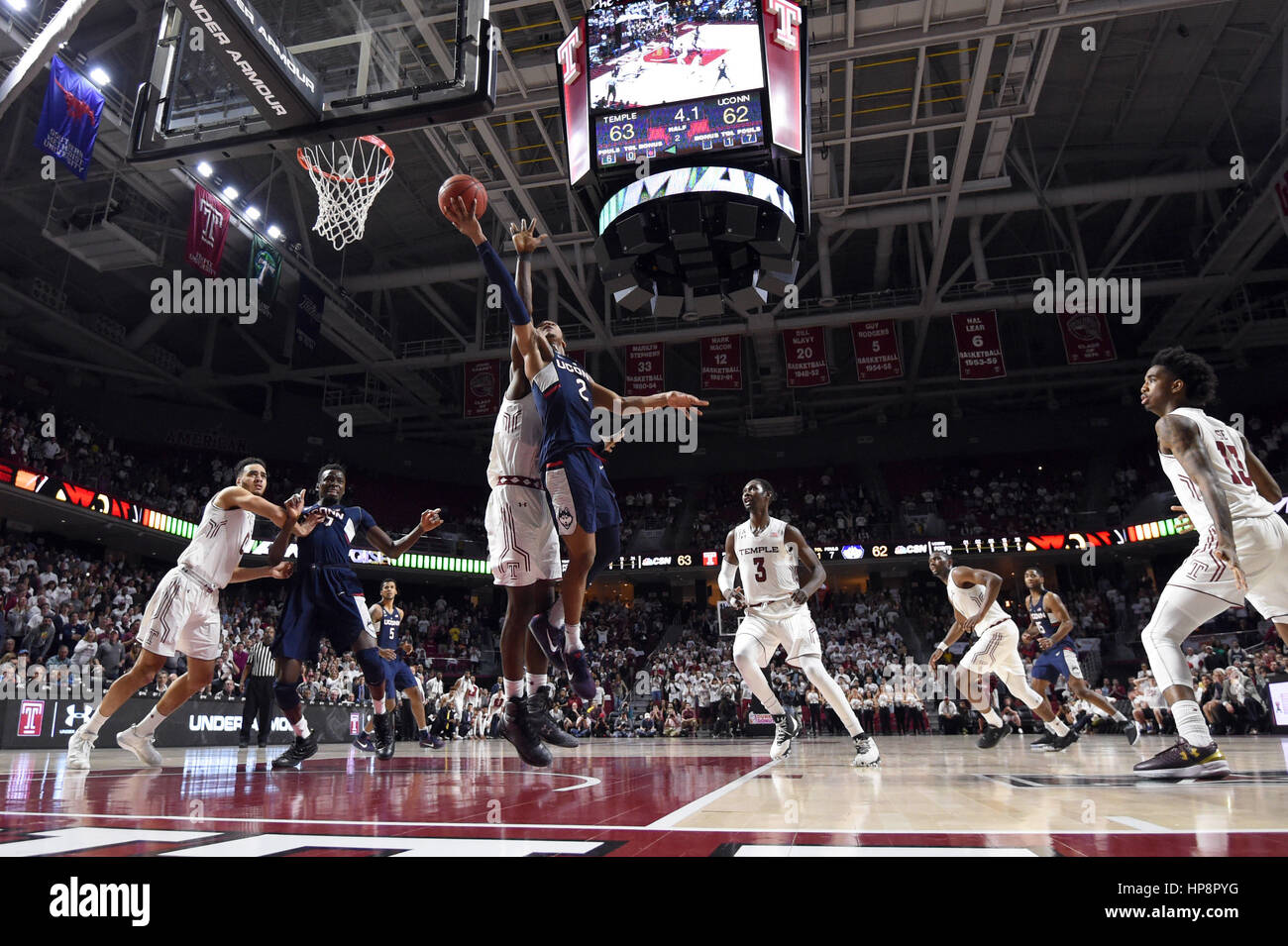 Philadelphia, Pennsylvania, USA. 19th Feb, 2017. Connecticut Huskies guard JALEN ADAMS (2) puts up what would be the game winning shot over Temple Owls center ERNEST AFLAKPUI (24) during the American Athletic Conference basketball game being played at the Liacouras Center in Philadelphia. UConn came back to beat Temple 64-63. Credit: Ken Inness/ZUMA Wire/Alamy Live News Stock Photo