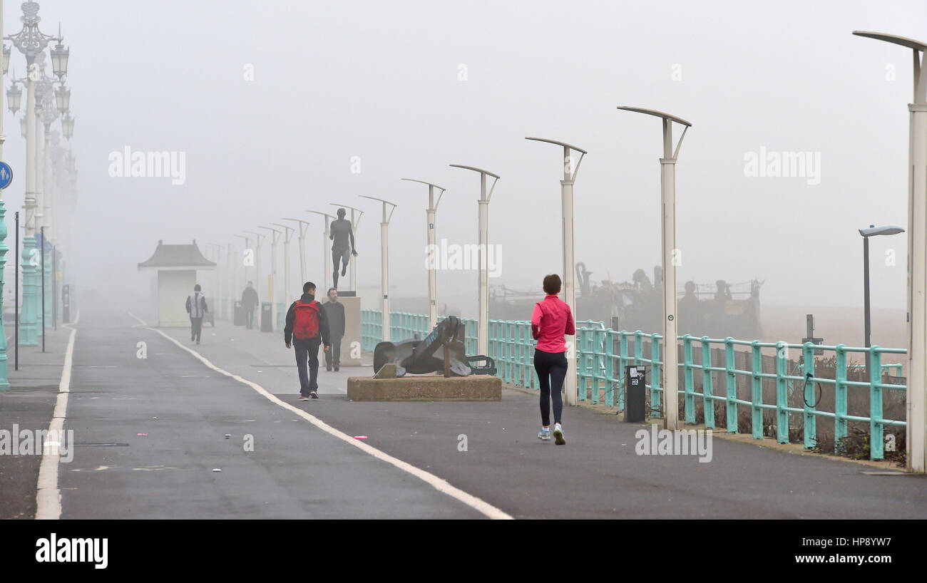 Brighton, Sussex, UK. 20th Feb, 2017. Runners in the fog along Brighton seafront this morning as temperatures of up to 17 degrees have been forecast for some parts of Britain Credit: Simon Dack/Alamy Live News Stock Photo