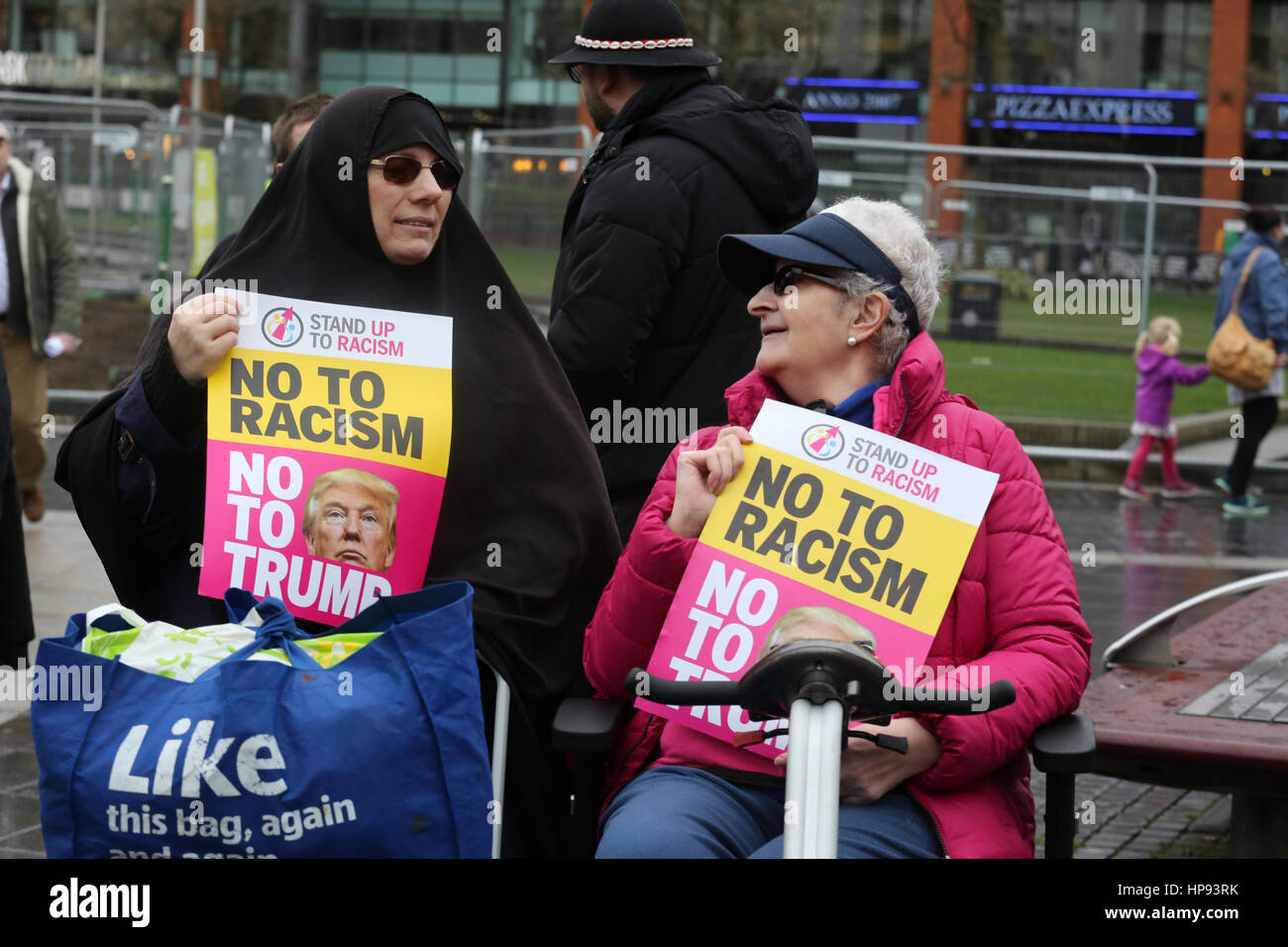 Manchester, UK. 20th February, 2017. Mariam khan and penny krantz with 'No to racism' placards, Piccadilly Gardens, Manchester,20th February, 2017 (C)Barbara Cook/Alamy Live News Stock Photo