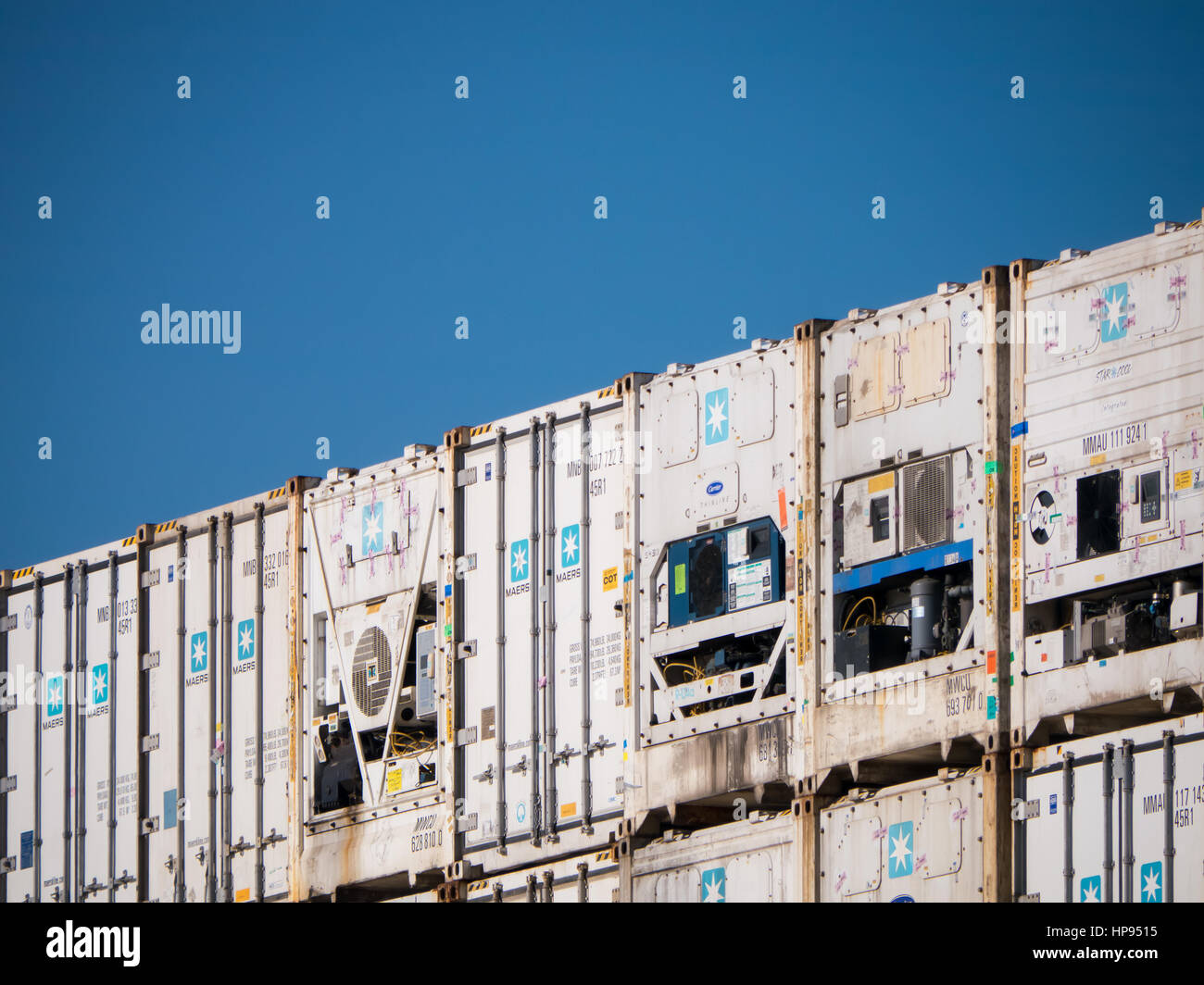 Air conditioned and refrigerated shipping containers against the sky Stock Photo