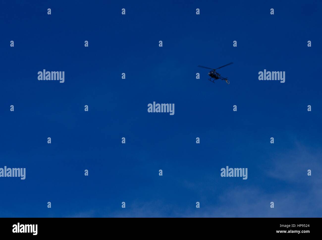 helicopter in the dark blue sky Stock Photo