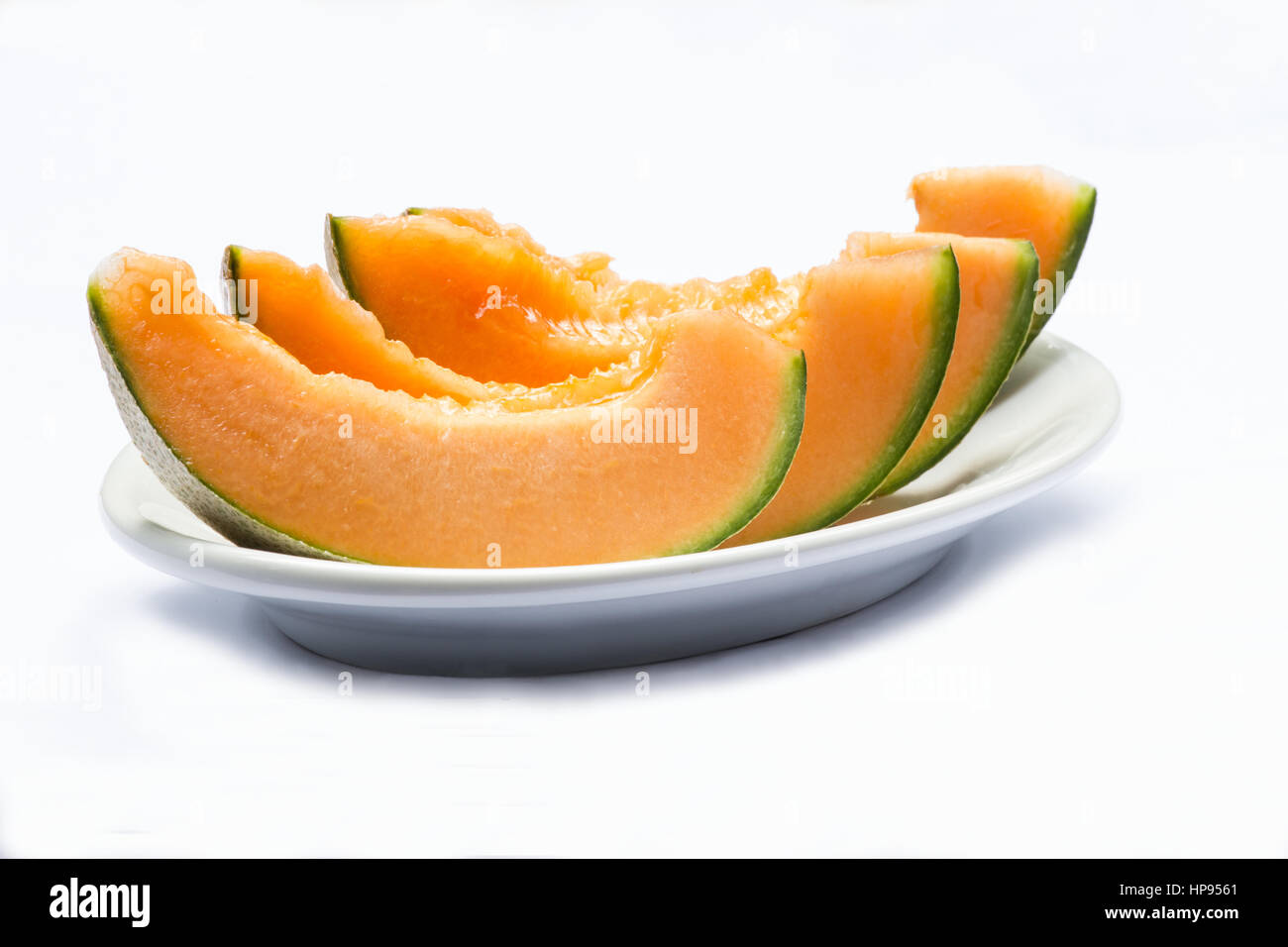 Melon slices on white background Stock Photo