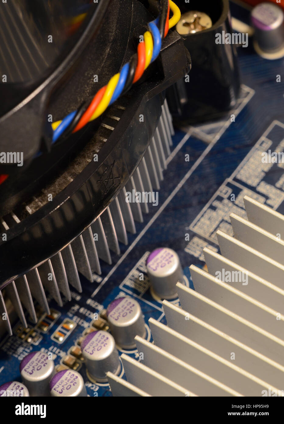 Close up of printed circuits on motherboard, the backbone of center of electrical connectivity for computer hardware and microcomputer systems includi Stock Photo