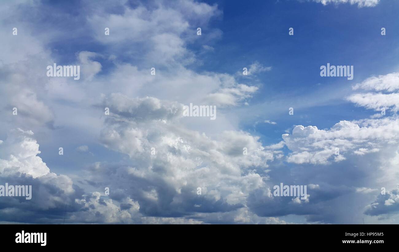Clear blue sky with soft white clouds Stock Photo - Alamy