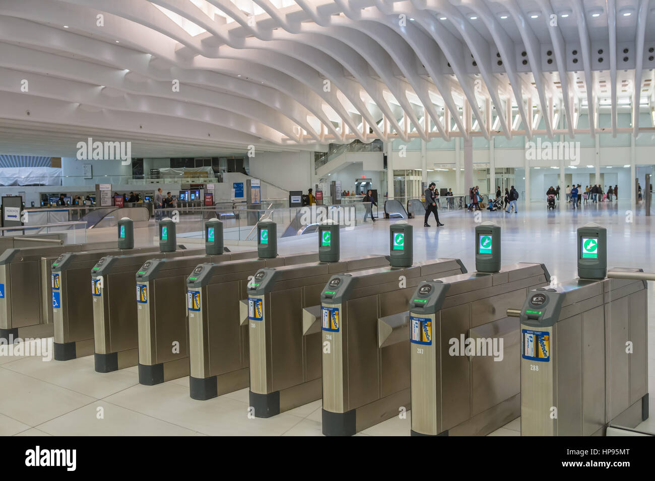Turnstiles await passengers at the PATH station in the World Trade Center Transportation Hub in New York City. Stock Photo
