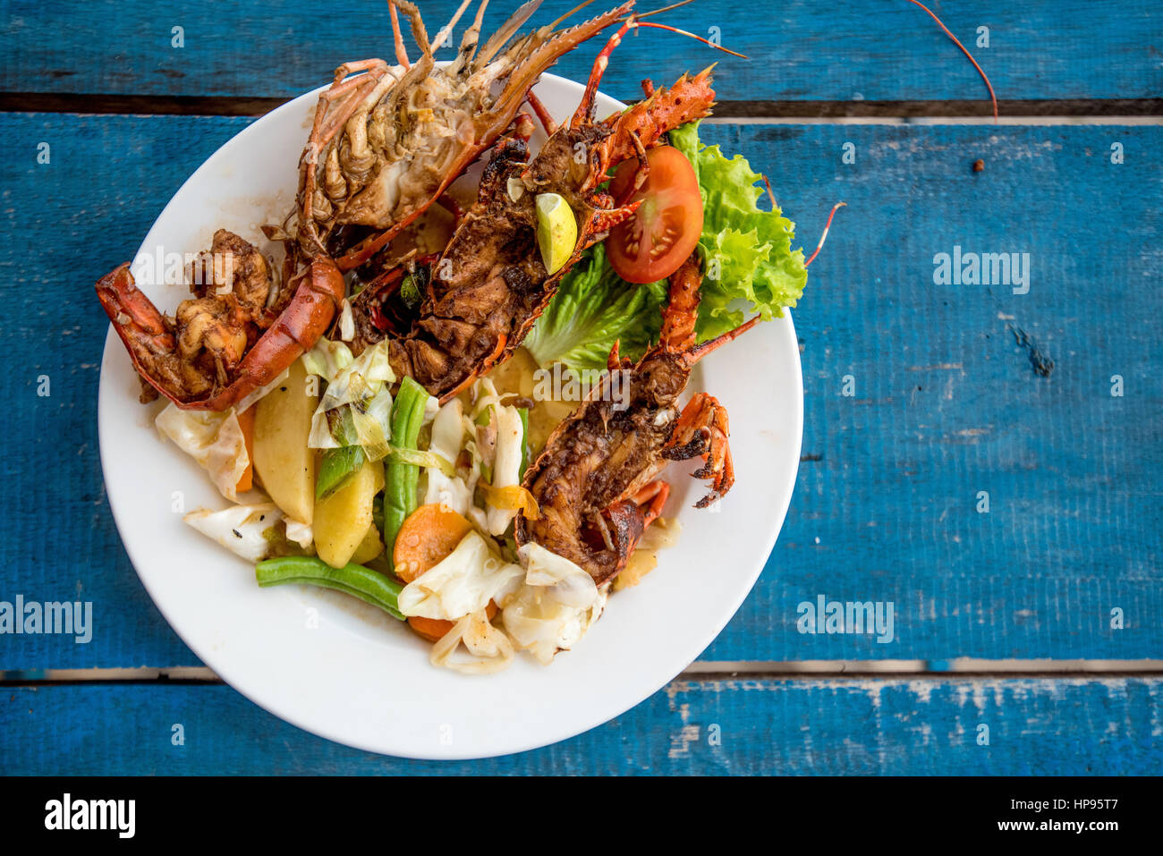 Tasty prepared lobsters and jumbo shrimps Stock Photo